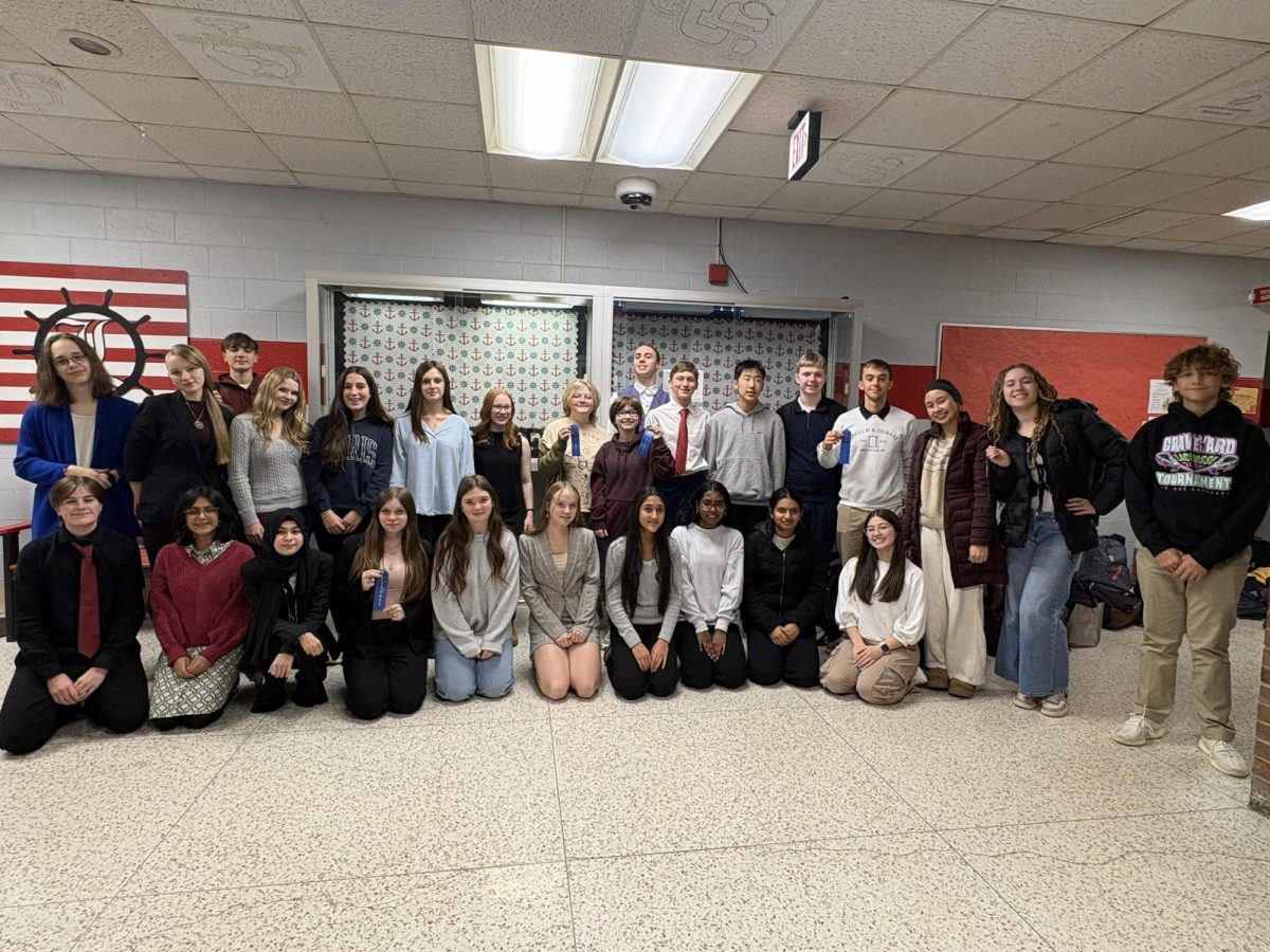 McDowell Speech and Debate team poses for a picture at a competition at Lakeview High School